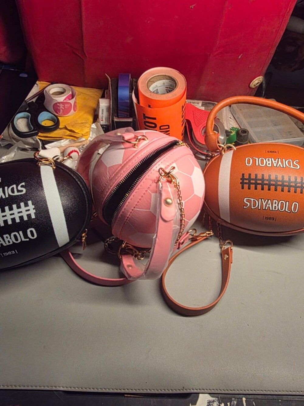 New Faux leather football, basketball, and soccer handbags.
